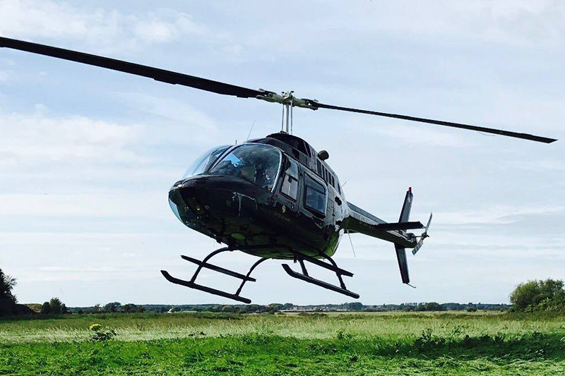 Charter flight to Bamburgh Castle in a Robinson R44